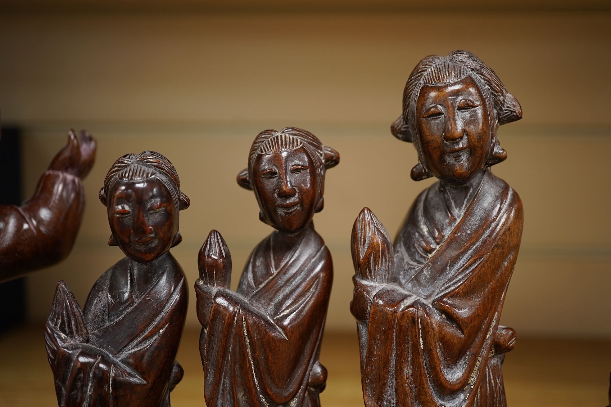 Six mid 20th century Chinese carved wood figures holding lotus and a Cultural Revolution carving of turin girls (7) tallest 21cm